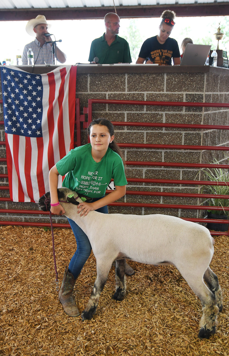 EILEEN SWOFFORD with the Double-S 4-H Club resells her lamb Saturday to benefit the Hermann FFA chapter.